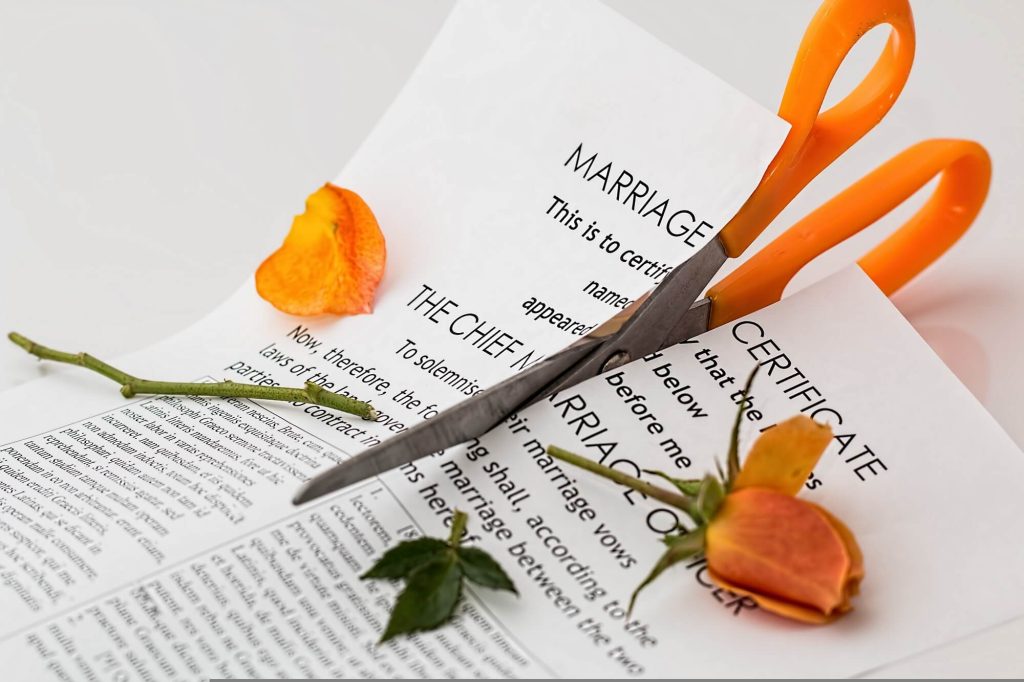 Marriage certificate being cut with scissors after annulment in Wyoming